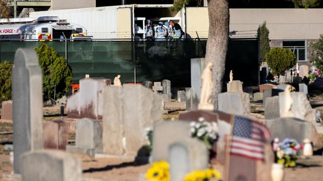 El Paso County detention inmates and morgue staff help move bodies to refrigerated trailers deployed next to a cemetery in El Paso, Texas on November 14. The US has now reported 250,537 deaths and over 12 million confirmed cases. (Mario Tama / Getty Images / AFP) El Paso County detention inmates and morgue staff help move bodies to refrigerated trailers deployed next to a cemetery in El Paso, Texas on November 14. The US has now reported 250,537 deaths and over 12 million confirmed cases. (Mario Tama / Getty Images / AFP)
