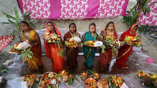 Women from Bihar perform rituals on the occasion of 'Chhath Puja' in Burari area of New Delhi. (PTI) Women from Bihar perform rituals on the occasion of 'Chhath Puja' in Burari area of New Delhi. (PTI)