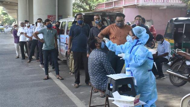People queue up to give samples for Covid-19 tests, in Surat, Tuesday, Sept. 29, 2020. (PTI) People queue up to give samples for Covid-19 tests, in Surat, Tuesday, Sept. 29, 2020. (PTI)