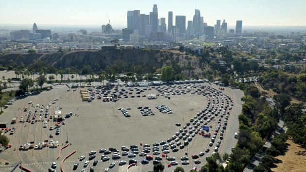 Drivers form long lines at a Covid-19 testing site in a parking lot at Dodger Stadium on November 17 in Los Angeles. The United States has surpassed 250,000 Covid-19 deaths, a bleak milestone as cases soar once again across the country, worst-hit by the deadly infectious disease. The virus is now killing at least one American every minute of the day, PTI reported citing CNN. (AP) Drivers form long lines at a Covid-19 testing site in a parking lot at Dodger Stadium on November 17 in Los Angeles. The United States has surpassed 250,000 Covid-19 deaths, a bleak milestone as cases soar once again across the country, worst-hit by the deadly infectious disease. The virus is now killing at least one American every minute of the day, PTI reported citing CNN. (AP)