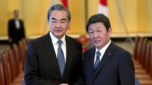 Chinese Foreign Minister Wang Yi, left, poses with his Japanese counterpart Toshimitsu Motegi for a photo prior to a meeting in Tokyo. (AP file photo) Chinese Foreign Minister Wang Yi, left, poses with his Japanese counterpart Toshimitsu Motegi for a photo prior to a meeting in Tokyo. (AP file photo)