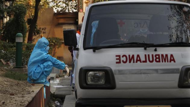 A health worker sits by an ambulance in New Delhi, India. (AP) A health worker sits by an ambulance in New Delhi, India. (AP)