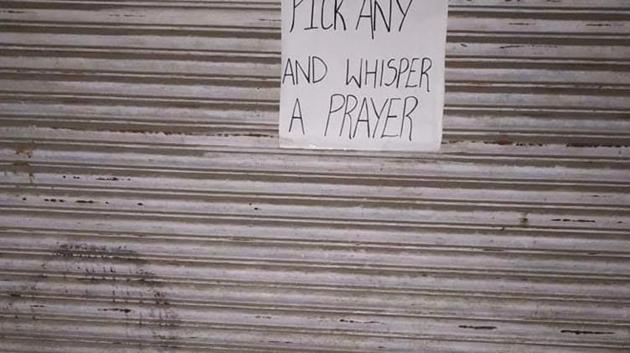 Clothing items kept on a pavement in Kohima, Nagaland, with the message “Pick any and whisper a prayer”. (Chenio N Odyuo) Clothing items kept on a pavement in Kohima, Nagaland, with the message “Pick any and whisper a prayer”. (Chenio N Odyuo)