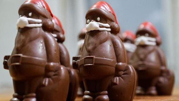 Chocolate Santas wearing protective face masks are seen in the workshop of the Hungarian confectioner Laszlo Rimoczi, during the coronavirus disease (COVID-19) outbreak in Lajosmizse, Hungary. (REUTERS)