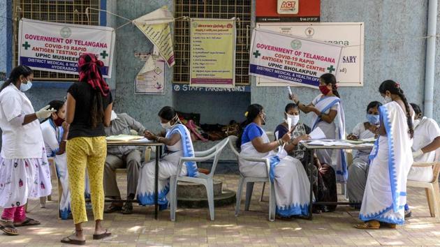 Medical staff register names of residents who came to undergo swab tests for Covid-19 at a primary health centre in Hyderabad on November 20. The national recovery rate has improved to 93.69% as on November 22 and the gap between recovered and active cases of the coronavirus disease has widened to 8,080,655. (Noah Seelam / AFP)