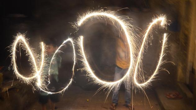 Children play with sparklers during Diwali. (Rishikesh Choudhary/HT) Children play with sparklers during Diwali. (Rishikesh Choudhary/HT)