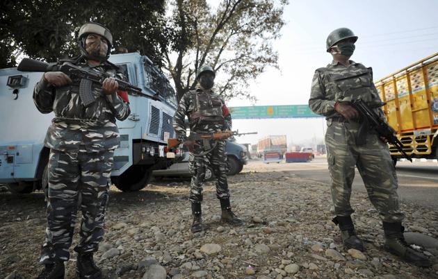 Central Reserve Police Force  (CRPF) personnel stand guard at the Jammu & Kashmir National Highway after  an encounter at Ban toll plaza in Nagrota in Jammu district on November 20.(PTI)