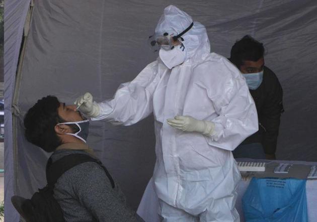 A passenger getting tested for Covid-19 at the ISBT in Sector 17, Chandigarh, on Sunday. (Keshav Singh/HT) A passenger getting tested for Covid-19 at the ISBT in Sector 17, Chandigarh, on Sunday. (Keshav Singh/HT)
