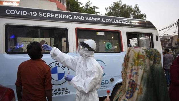 A health worker collects a swab sample from a man for Reverse Transcription-Polymerase Chain Reaction (RT-PCR) based coronavirus testing in Gurugram in this file photo. (HT Photo/ Parveen Kumar) A health worker collects a swab sample from a man for Reverse Transcription-Polymerase Chain Reaction (RT-PCR) based coronavirus testing in Gurugram in this file photo. (HT Photo/ Parveen Kumar)