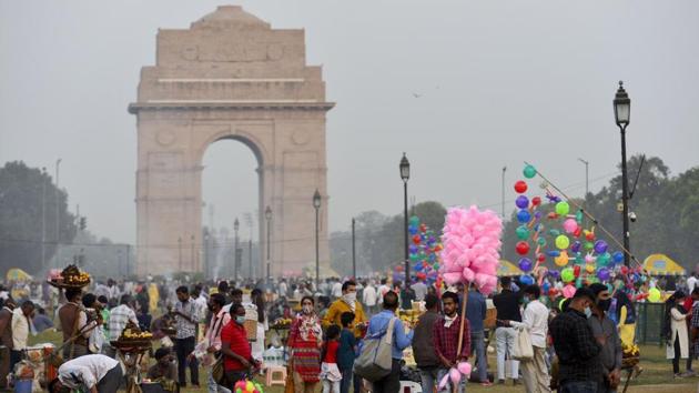 People are seen at Rajpath lawns in the backdrop of India Gate in New Delhi in this file photo.(PTI Photo) People are seen at Rajpath lawns in the backdrop of India Gate in New Delhi in this file photo.(PTI Photo)
