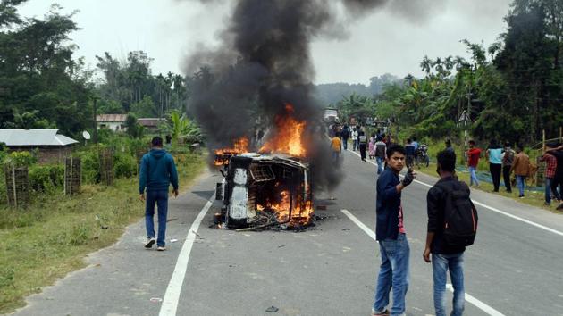 A vehicle in flames during a protest by the Joint Movement Committee (JMC) against the resettlement of displaced Bru migrants in Kanchanpur sub-division, at Panisagar in North Tripura district. (PTI Photo) A vehicle in flames during a protest by the Joint Movement Committee (JMC) against the resettlement of displaced Bru migrants in Kanchanpur sub-division, at Panisagar in North Tripura district. (PTI Photo)