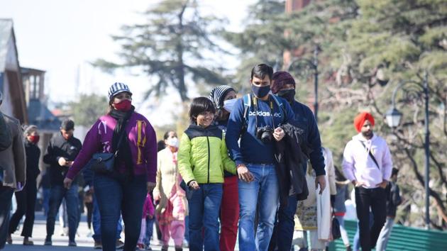 Tourists strolling at The Ridge in Shimla on Sunday. (Deepak Sansta/HT) Tourists strolling at The Ridge in Shimla on Sunday. (Deepak Sansta/HT)