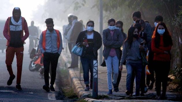 Commuters seen wearing warm clothes on a cold winter morning in Gurugram on November 20. In the plains, towns such as Hisar in Haryana, Churu in Rajasthan and Adampur in Punjab, too, recorded minimum temperatures that were 4-5 degrees below normal on November 20. (PTI)