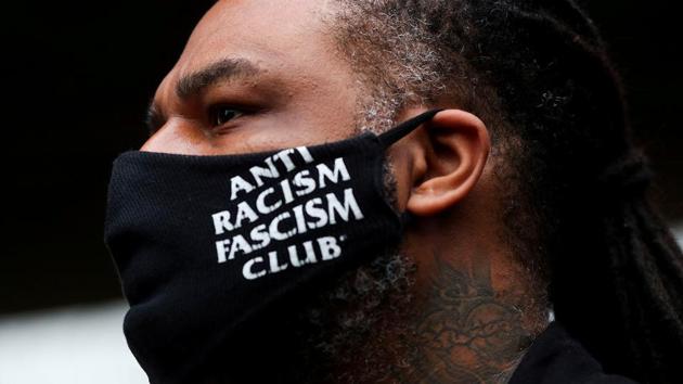 A demonstrator’s face mask reads “Anti racism fascism club” during a protest march in Sao Paulo on November 20. The video clip from the supermarket quickly went viral on social media and triggered the first round of demonstrations on November 20 as the country marked Black Consciousness Day. (Amanda Perobelli / REUTERS) A demonstrator’s face mask reads “Anti racism fascism club” during a protest march in Sao Paulo on November 20. The video clip from the supermarket quickly went viral on social media and triggered the first round of demonstrations on November 20 as the country marked Black Consciousness Day. (Amanda Perobelli / REUTERS)