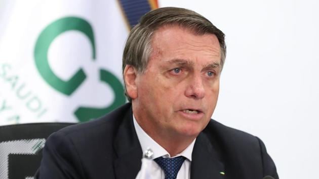 Brazilian President Jair Bolsonaro once again downplayed structural racism in Brazil while speaking at the G20 summit via video conference from Planalto Palace in Brasilia on November 21. Bolsonaro condemned “those who want to sow conflict and discord” by trying to “import” tensions into the country “that are not part of its history,” AFP reported. (Marcos Correa / Brazilian Presidency / AFP) Brazilian President Jair Bolsonaro once again downplayed structural racism in Brazil while speaking at the G20 summit via video conference from Planalto Palace in Brasilia on November 21. Bolsonaro condemned “those who want to sow conflict and discord” by trying to “import” tensions into the country “that are not part of its history,” AFP reported. (Marcos Correa / Brazilian Presidency / AFP)