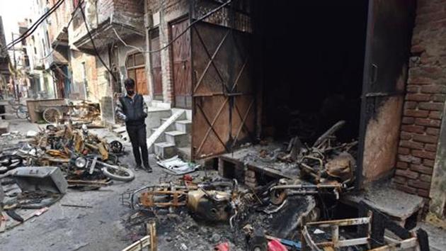 A man stands near burnt motorcycles in a riot-affected area, at Shiv Vihar, in New Delhi.(Sanchit Khanna/HT PHOTO) A man stands near burnt motorcycles in a riot-affected area, at Shiv Vihar, in New Delhi.(Sanchit Khanna/HT PHOTO)