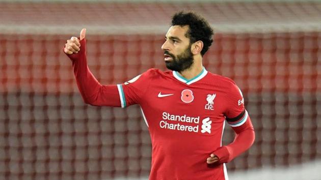 FILE PHOTO: Soccer Football - Premier League - Liverpool v West Ham United - Anfield, Liverpool, Britain - October 31, 2020 Liverpool's Mohamed Salah celebrates scoring their first goal Pool via REUTERS/Peter Powell(Pool via REUTERS)