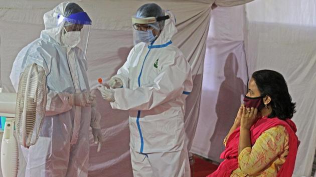 Health staff taking swab samples in the city.(Ravindra Joshi/HT PHOTO)
