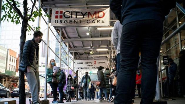People wait in line outside of a coronavirus disease (Covid-19) testing center in New York, US.(Reuters)