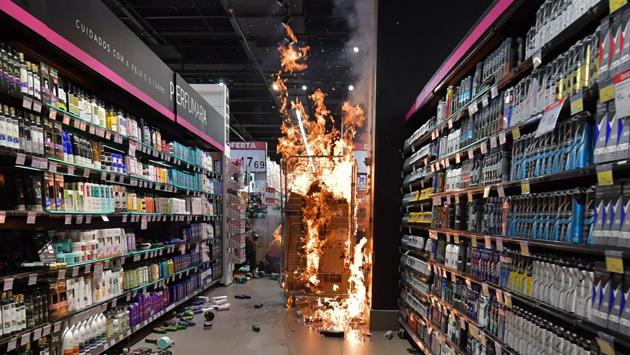 Products set on fire by protesters at a supermarket Carrefour on Black Consciousness Day during a protest against racism and the death of a black man who was beaten to death by white security agents in a supermarket of the same chain, in Sao Paulo on November 20. (Nelson Almeida / AFP) Products set on fire by protesters at a supermarket Carrefour on Black Consciousness Day during a protest against racism and the death of a black man who was beaten to death by white security agents in a supermarket of the same chain, in Sao Paulo on November 20. (Nelson Almeida / AFP)