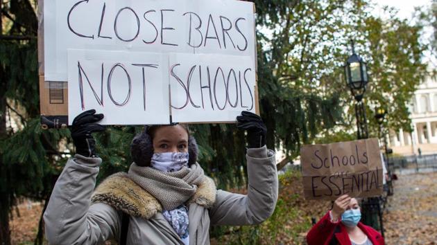 Parents protest demanding that public schools remain open, outside New York's City Hall on November 19. Deborah Birx, the White House Coronavirus Task Force coordinator, has warned that more than half the country is a “red zone” where the virus is rampant. In response, officials in more than 20 states have imposed restrictions with hospitalizations at record highs in 29 states in November, straining already exhausted medical staff. (Kena Betancur / AFP) Parents protest demanding that public schools remain open, outside New York's City Hall on November 19. Deborah Birx, the White House Coronavirus Task Force coordinator, has warned that more than half the country is a “red zone” where the virus is rampant. In response, officials in more than 20 states have imposed restrictions with hospitalizations at record highs in 29 states in November, straining already exhausted medical staff. (Kena Betancur / AFP)
