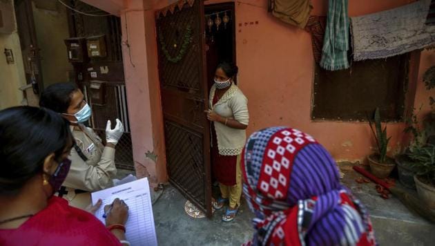 Health workers conduct a door to door survey to assess the Covid-19 situation in New Delhi. (AP Photo) Health workers conduct a door to door survey to assess the Covid-19 situation in New Delhi. (AP Photo)