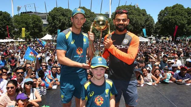 MELBOURNE, AUSTRALIA - DECEMBER 23: Virat Kohli of India and Tim Paine of Australia along with Archie Shiller from the Make A Wish foundation who will be co-captain on Boxing Day pose with the BorderÐGavaskar Trophy ahead of the Boxing Day Test during the Indian Summer Festival Family Day at the Melbourne Cricket Ground on December 23, 2018 in Melbourne, Australia.(Cricket Australia/Getty Images)