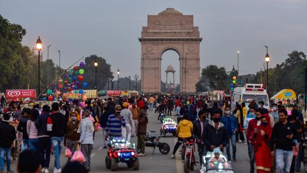 Visitors at India Gate in New Delhi on November 22. Delhi is experiencing a colder than normal winter because of global factors such as La Nina, a global weather pattern linked to low minimum temperatures in northwest India, HT reported. (Manvender Vashist / PTI ) 