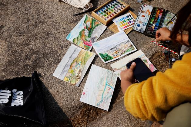 Drawings by Kim Kang-Eun, an artist who leads Clean Hikers, and her colleagues are seen on a mountain in Incheon, South Korea, November 16, 2020. (REUTERS)