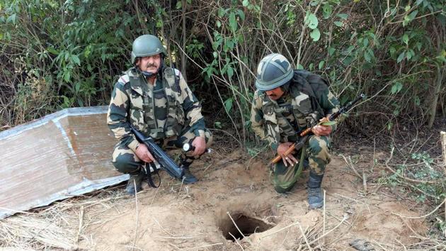 BSF personnel carry out an extensive search near Regal Post along the International Border, a day after an underground tunnel was detected by the forces, in Samba district on November 23.(PTI)