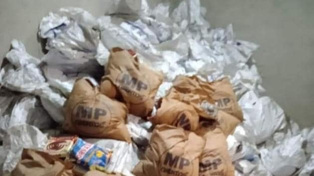 Rotten food kits carrying the photo of Gandhi and printed MP in bold were found when a vacant shop in Nilambur in Malappuram district, which was closed for many months was opened.(HT PHOTO.) Rotten food kits carrying the photo of Gandhi and printed MP in bold were found when a vacant shop in Nilambur in Malappuram district, which was closed for many months was opened.(HT PHOTO.)