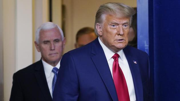 President Donald Trump walking out to speak in the Brady Briefing Room in the White House, Tuesday, Nov. 24, 2020, in Washington. Walking behind Trump is Vice President Mike Pence. (AP Photo/Susan Walsh)(AP)