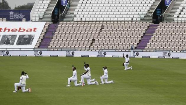 West Indies' players take a knee in support of the Black Lives Matter movement before the start of the first day of the 1st cricket Test match between England and West Indies, at the Ageas Bowl in Southampton. (AP) West Indies' players take a knee in support of the Black Lives Matter movement before the start of the first day of the 1st cricket Test match between England and West Indies, at the Ageas Bowl in Southampton. (AP)