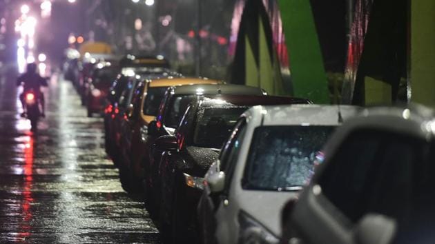 Residents park their vehicles on a flyover before the landfall of Cyclone Nivar, at Velachery in Chennai.(PTI)