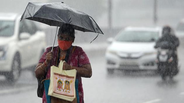 A woman walks under an umbrella during heavy rains as cyclone Nivar approaches the eastern Indian coast, in Chennai on November 24. After remaining below 39,000 for three days last week, daily COvid-19 cases again soared past 40,000 daily and have been on the rise since, HT reported. (Arun Sankar / AFP) A woman walks under an umbrella during heavy rains as cyclone Nivar approaches the eastern Indian coast, in Chennai on November 24. After remaining below 39,000 for three days last week, daily COvid-19 cases again soared past 40,000 daily and have been on the rise since, HT reported. (Arun Sankar / AFP)