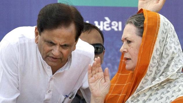 Congress president Sonia Gandhi and Congress Rajya Sabha MP Ahmed Patel seen speaking to each other at a rally in Rajkot in this file picture.(PTI File)