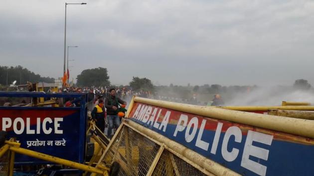 Haryana Police using water cannons against farmers from Punjab trying to gain access into Ambala district from Patiala at Shambu barrier on Thursday.(Bharat Bhushan/HT)