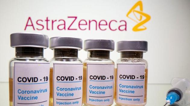 FILE PHOTO: Vials with a sticker reading, "COVID-19 / Coronavirus vaccine / Injection only" and a medical syringe are seen in front of a displayed AstraZeneca logo in this illustration taken October 31, 2020. REUTERS/Dado Ruvic/Illustration/File Photo/File Photo