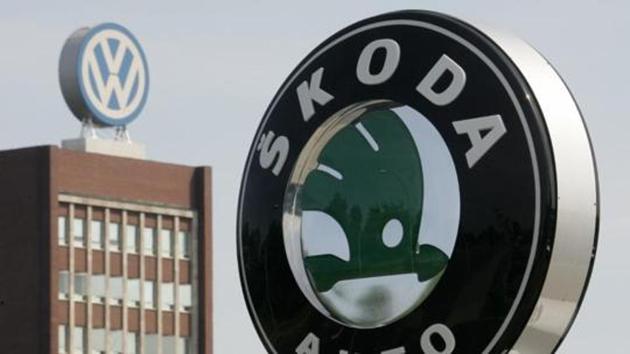 The logo of Skoda cars is seen beside main building of Volkswagen brand at the company's headquarters in Wolfsburg.(Reuters File Photo)