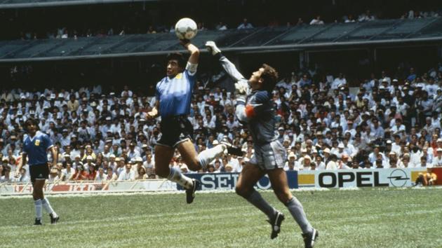 Argentina's Diego Maradona scores 1st goal with his Hand of God, past England goalkeeper Peter Shilton.(Bob Thomas/Getty Images) Argentina's Diego Maradona scores 1st goal with his Hand of God, past England goalkeeper Peter Shilton.(Bob Thomas/Getty Images)