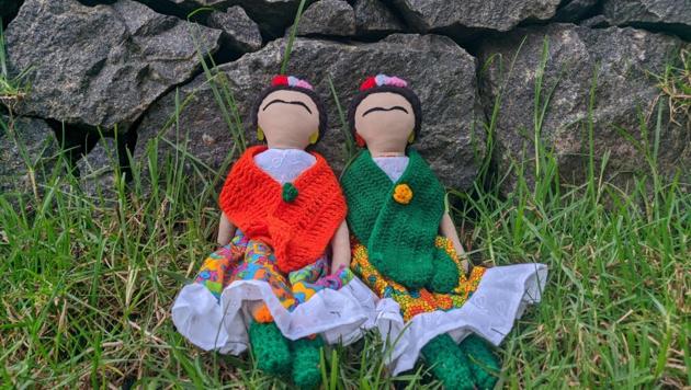 The dolls are faceless, but instantly recognisable.You can tell Frida Kahlo from her brows and flowers.