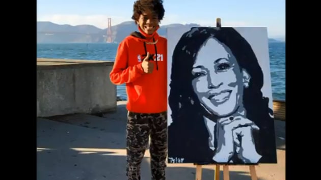 The image shows Tyler Gordon, 14, with Kamala Harris’ portrait.(Twitter/@Official_tylerg)