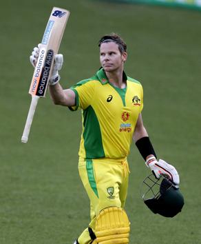 Australia's Steve Smith waves his bat as he walks from the field after he was dismissed for 105 runs during the one day international cricket match between India and Australia at the Sydney Cricket Ground in Sydney, Australia, Friday, Nov. 27, 2020. (AP Photo/Rick Rycroft) (AP) 