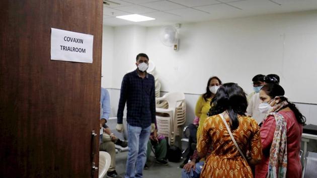 People wait during the administration of Covaxin, a government-backed experimental Covid-19 vaccine, during its human trials, at the Gujarat Medical Education & Research Society in Ahmedabad, on Thursday.(PTI Photo) People wait during the administration of Covaxin, a government-backed experimental Covid-19 vaccine, during its human trials, at the Gujarat Medical Education & Research Society in Ahmedabad, on Thursday.(PTI Photo)