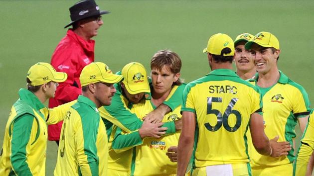 Australia's Adam Zampa and Mitchell Starc celebrate with teammates after taking the wicket of India's Shikhar Dhawan.(REUTERS)