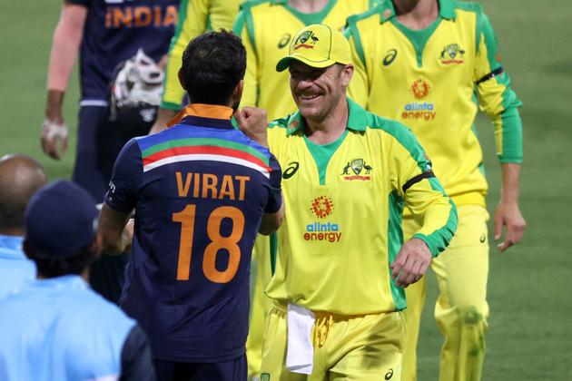 Cricket - First One Day International - Australia v India - Sydney Cricket Ground, Sydney, Australia - November 27, 2020 India's Virat Kohli and Australia's Aaron Finch after the match REUTERS/Loren Elliott (REUTERS) 