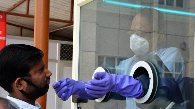 A man being tested for Covid-19 , at Ram Manohar Lohia Hospital, Gomti Nagar, in Lucknow.(HT file) A man being tested for Covid-19 , at Ram Manohar Lohia Hospital, Gomti Nagar, in Lucknow.(HT file)