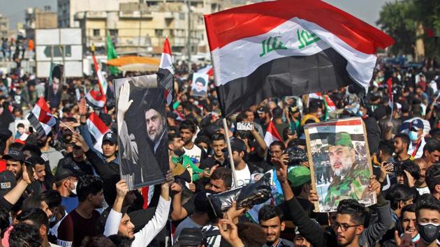 Most of al-Sadr’s followers stood unmasked in the square, chanting: “Yes, yes for our leader,” in support of the firebrand cleric as Iraq remains a high-risk country for coronavirus infection.(AFP Photo) Most of al-Sadr’s followers stood unmasked in the square, chanting: “Yes, yes for our leader,” in support of the firebrand cleric as Iraq remains a high-risk country for coronavirus infection.(AFP Photo)