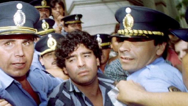 Maradona is escorted out of a courthouse amid charges that he shot and injured journalists outside his home in 1994. “Whatever good I may do, they will still remember me for the bad I’ve done,” he once said.(Reuters)