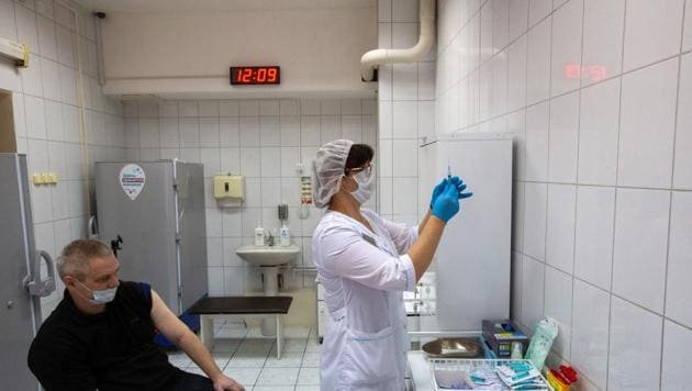 A health worker prepares a needle to inject the 'Gam-COVID-Vac', also known as 'Sputnik V', COVID-19 vaccine, developed by the Gamaleya National Research Center for Epidemiology and Microbiology and the Russian Direct Investment Fund (RDIF), during a trial at the City Clinic #2 in Moscow, Russia, on Thursday, Nov. 26, 2020 (Photographer: Andrey Rudakov/Bloomberg)(Bloomberg) A health worker prepares a needle to inject the 'Gam-COVID-Vac', also known as 'Sputnik V', COVID-19 vaccine, developed by the Gamaleya National Research Center for Epidemiology and Microbiology and the Russian Direct Investment Fund (RDIF), during a trial at the City Clinic #2 in Moscow, Russia, on Thursday, Nov. 26, 2020 (Photographer: Andrey Rudakov/Bloomberg)(Bloomberg)